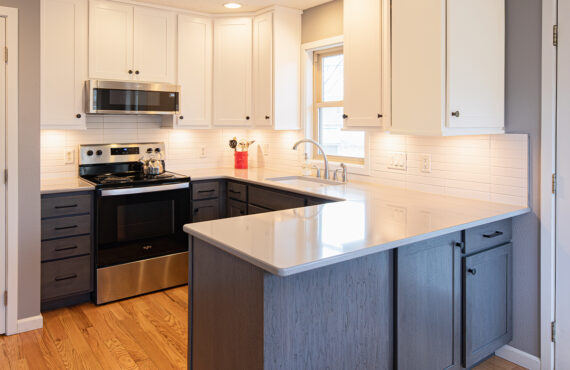 White uppers and gray stained lower kitchen cabinets