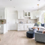 White cabinets with blue chairs in a seating area