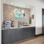 Gray coffee bar cabinets.