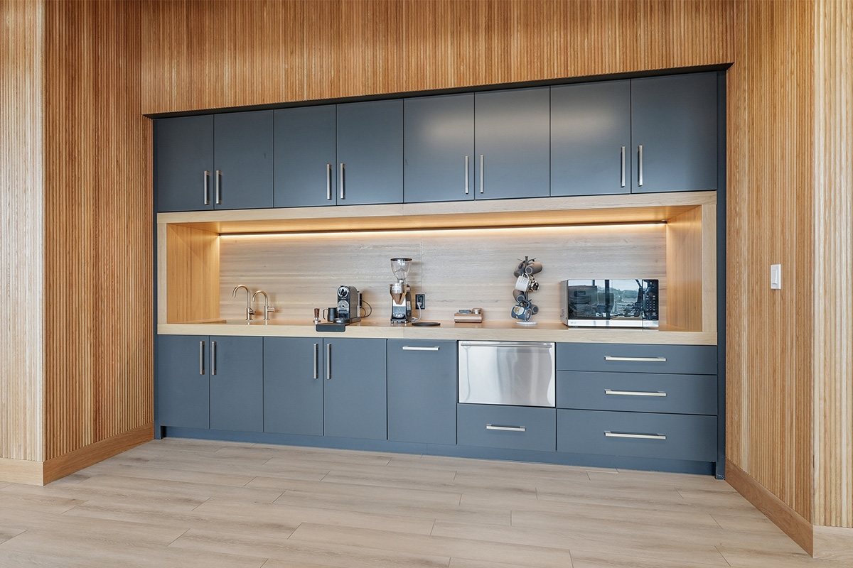 Gray painted office breakroom kitchenette.