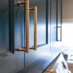 Emerald blue laundry cabinets