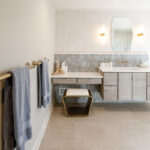 Large master bathroom with 2 vanity areas with light Montana stain, powder desk.