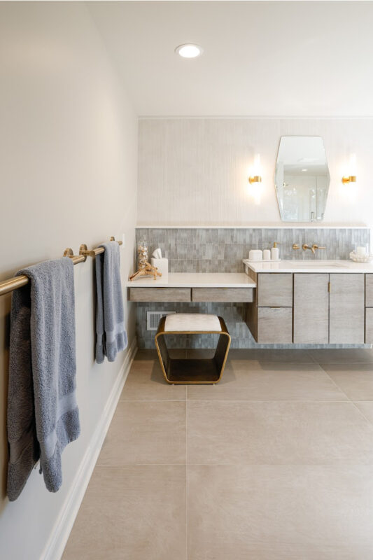 Large master bathroom with 2 vanity areas with light Montana stain, powder desk.
