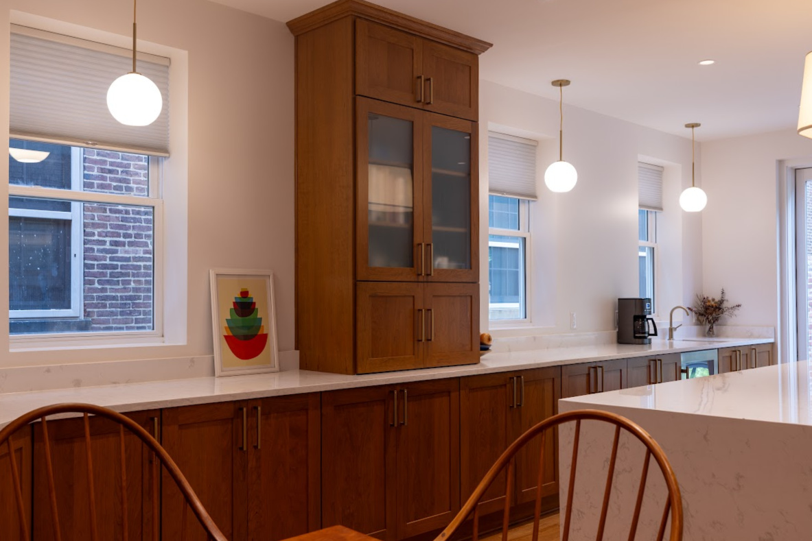 Cherry kitchen cabinets with a red Sienna stain. The layout is only one wall cabinet (intalled on countertop) installed.