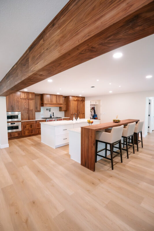Walnut kitchen cabinets with white double islands