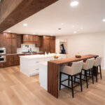Walnut kitchen cabinets with white double islands