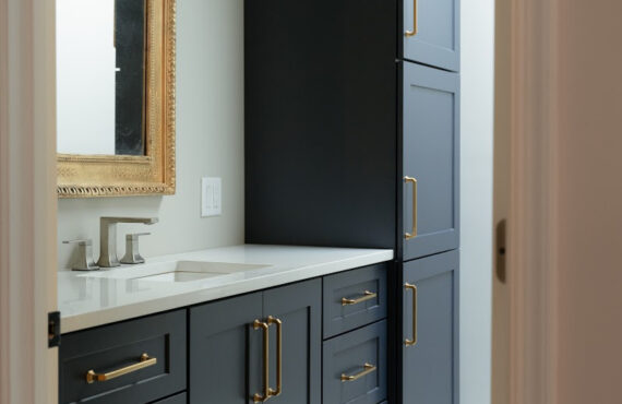 Dark Blue bathroom vanity and linen cabinets.