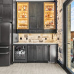 Kitchen cabinets with dark Midnight stain on Rustic Alder.