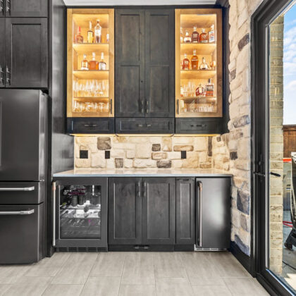 Kitchen cabinets with dark Midnight stain on Rustic Alder.