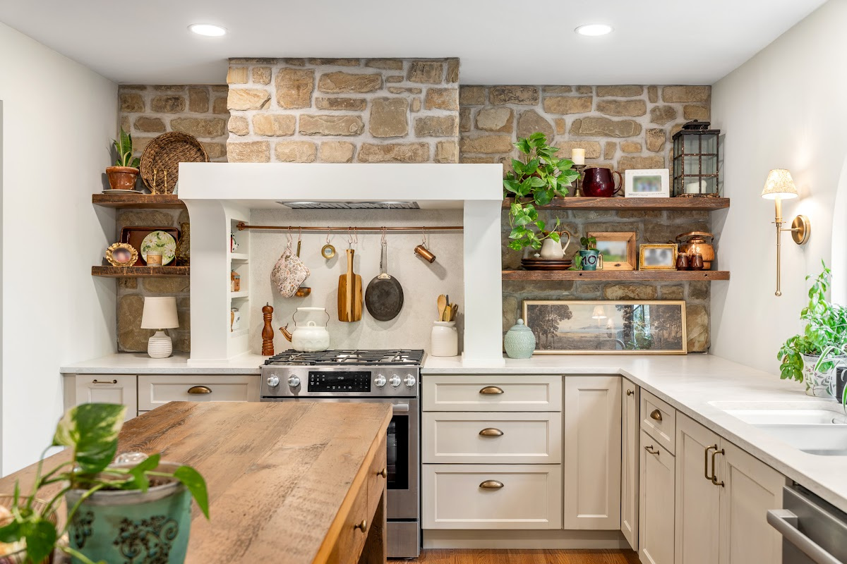 Old World style kitchen with Light Mocha-painted perimeter and a custom wood island in a mid-brown stain.
