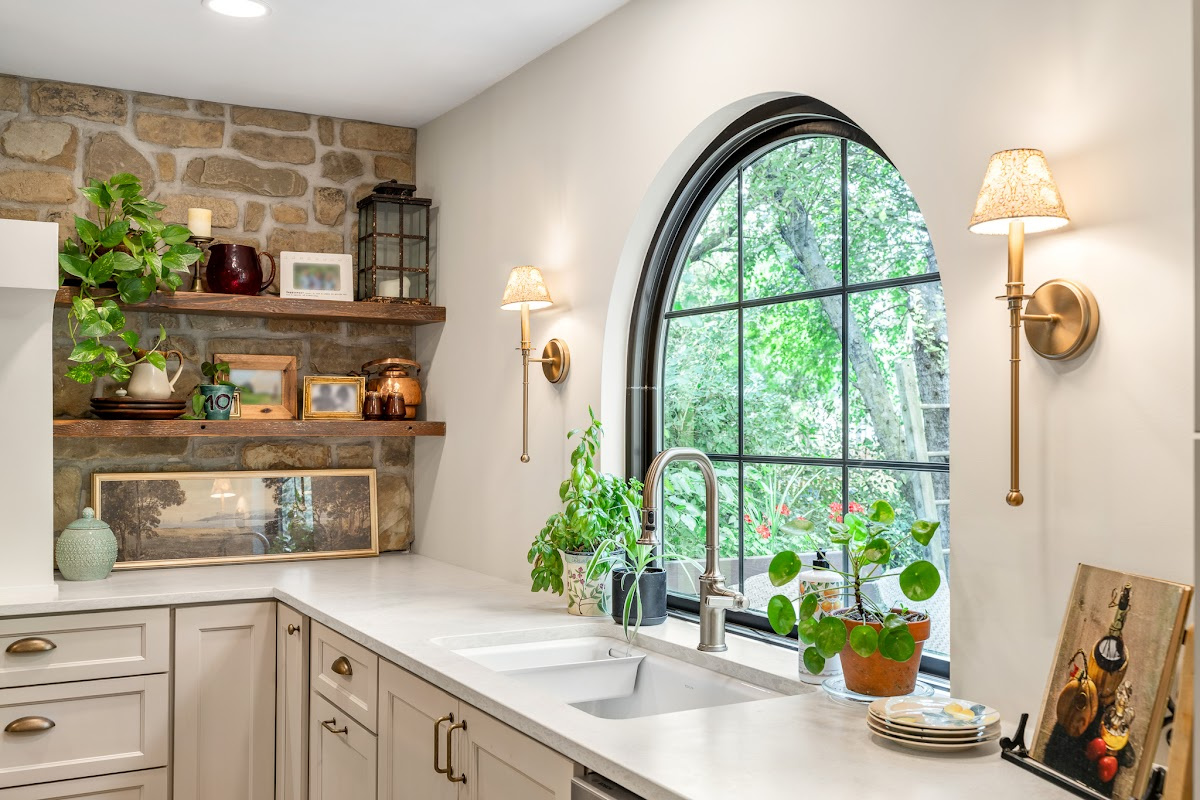 Large arched window above kitchen sink and other cabinets with Light Mocha paint.
