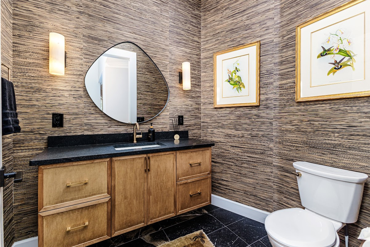 Bathroom with warm, organic tones, including a brown-stained vanity cabinet.