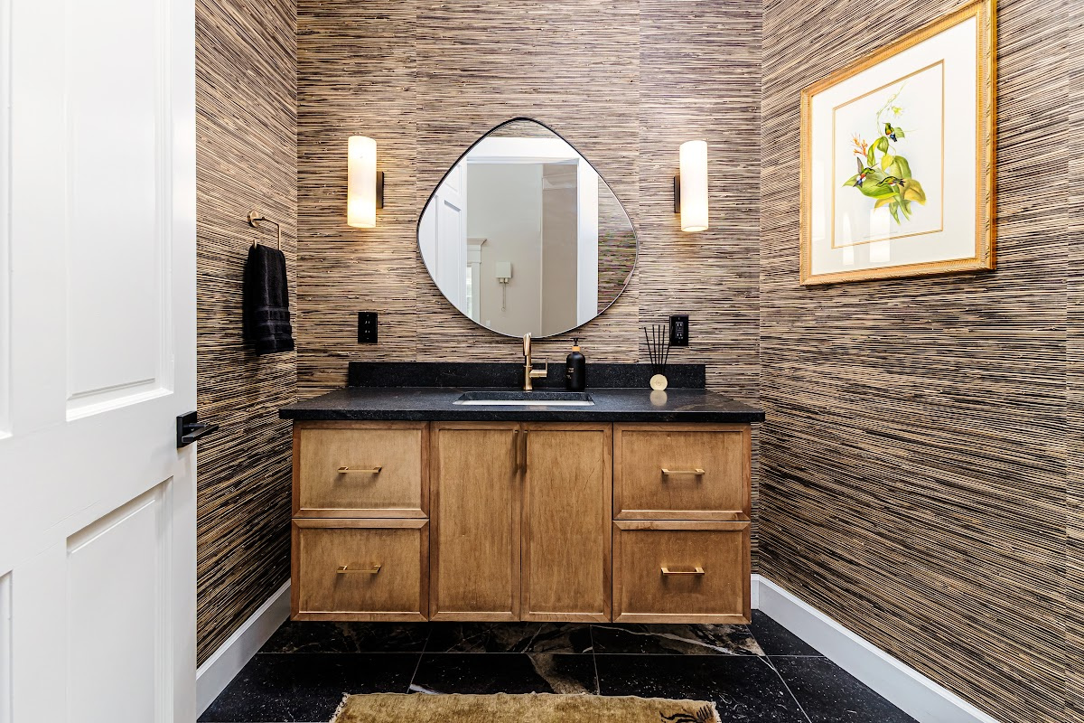 Bathroom with warm, organic tones, including a brown-stained vanity cabinet.