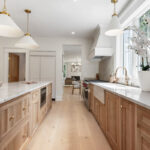 White and light brown kitchen cabinets.
