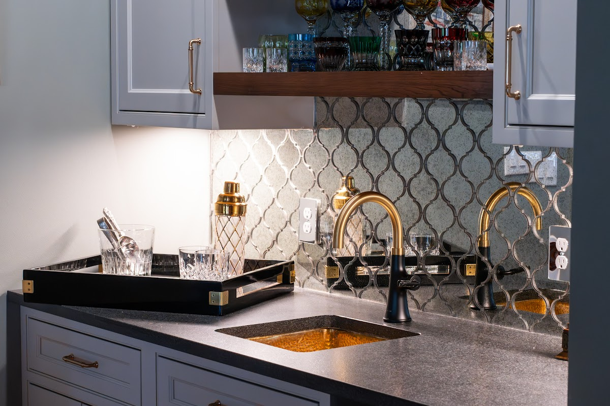 Painted gray kitchen cabinets with black range