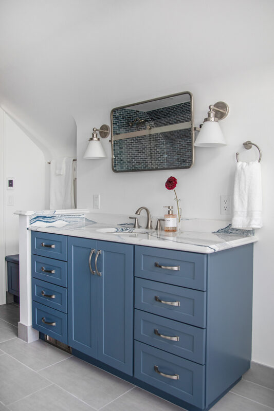 Bathroom with blue cabinetry
