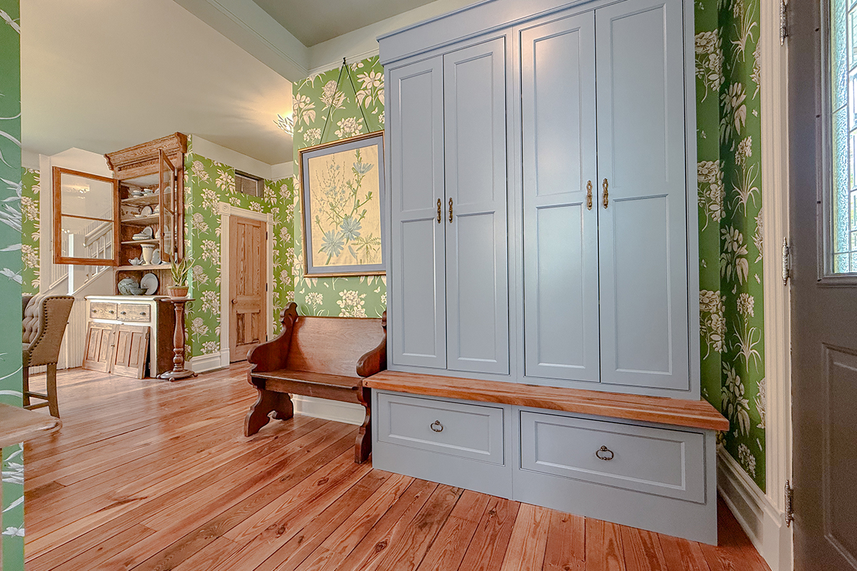 Light blue tall storage cabinet with bench seating