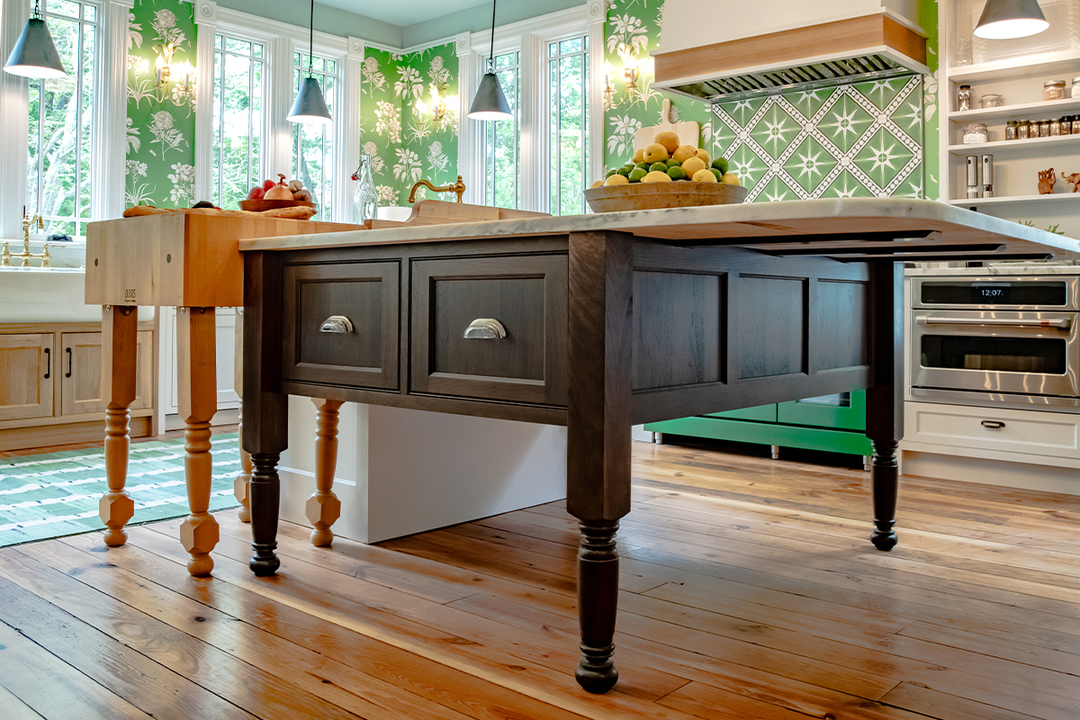 Island furniture cabinet in walnut with Tawny stain and extended countertop.