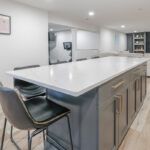 Blue painted island cabinets.