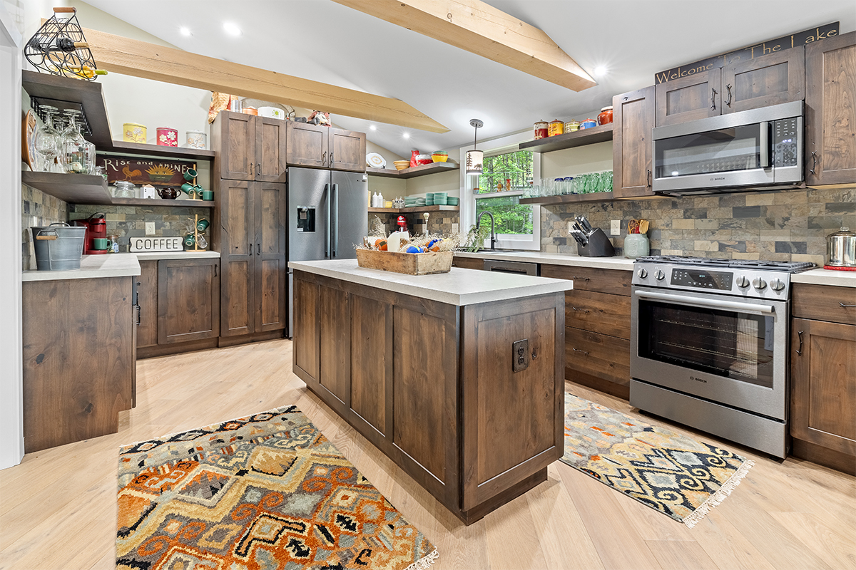 Rustic Alder kitchen with ceiling beams and floating shelves.