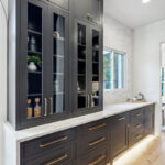 Kitchen with dark Iron Ore painted cabinets.