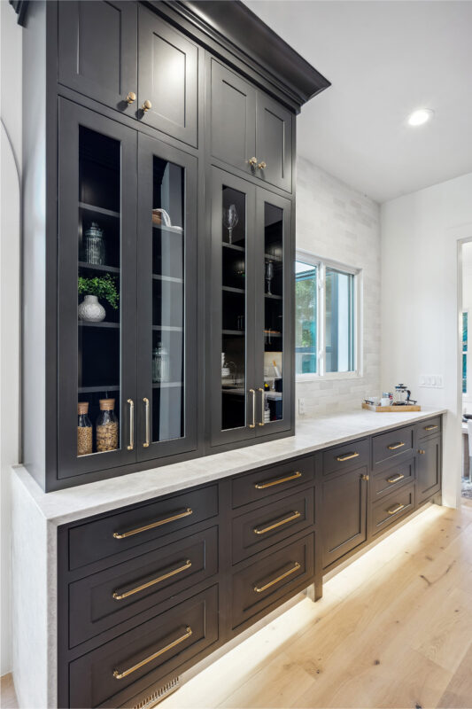 Kitchen with dark Iron Ore painted cabinets.