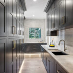 Kitchen with dark Iron Ore painted cabinets.
