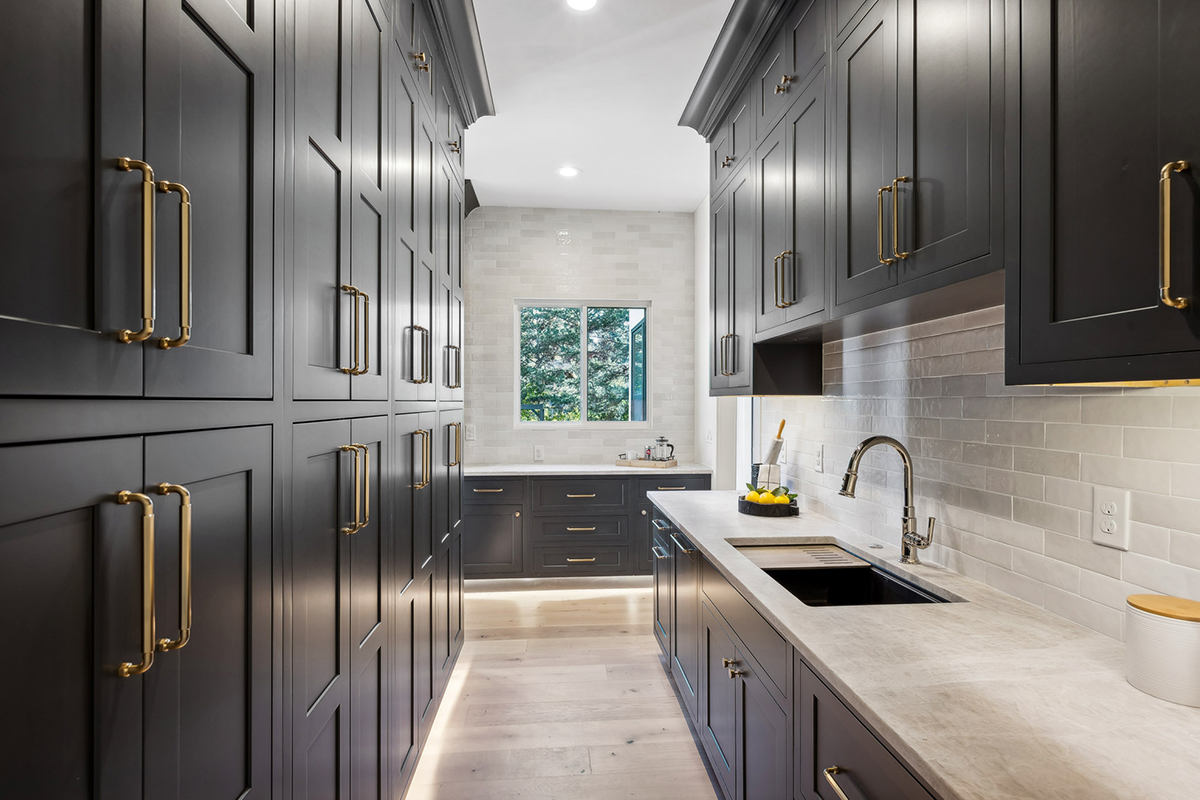 Kitchen with dark Iron Ore painted cabinets.