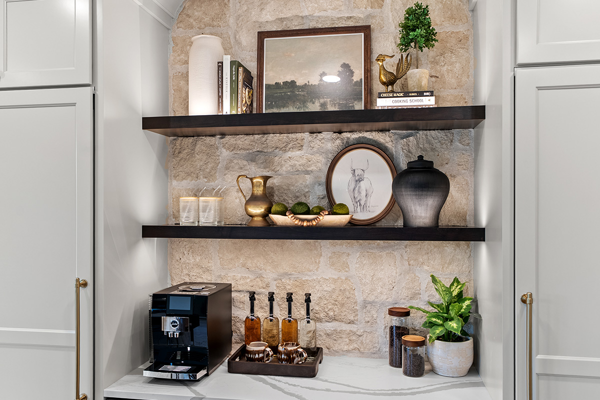 White kitchen cabinets with dark stained floating shelves