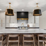 White and dark stained kitchen cabinets with white counter.