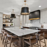 White and dark stained kitchen cabinets with white counter.