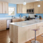 Modern Mid-Century kitchen with slab doors in maple natural