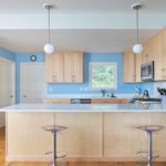 Modern Mid-Century kitchen with slab doors in maple natural