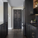 Painted black basement bar cabinets