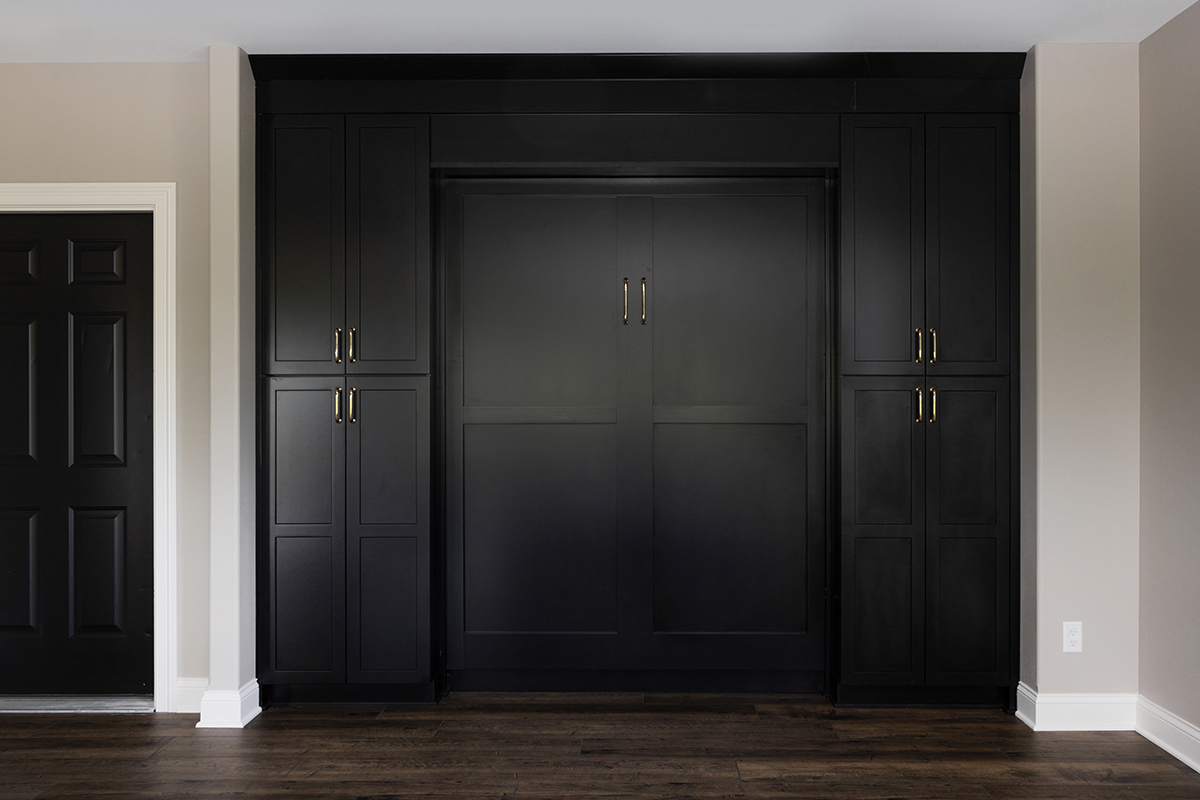 Painted black basement bar cabinets