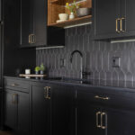 Painted black basement bar cabinets