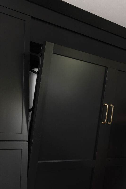 Painted black basement bar cabinets