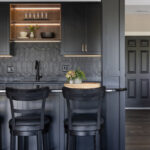 Painted black basement bar cabinets