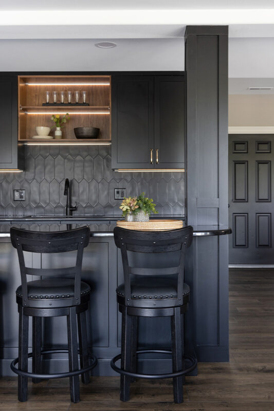 Painted black basement bar cabinets
