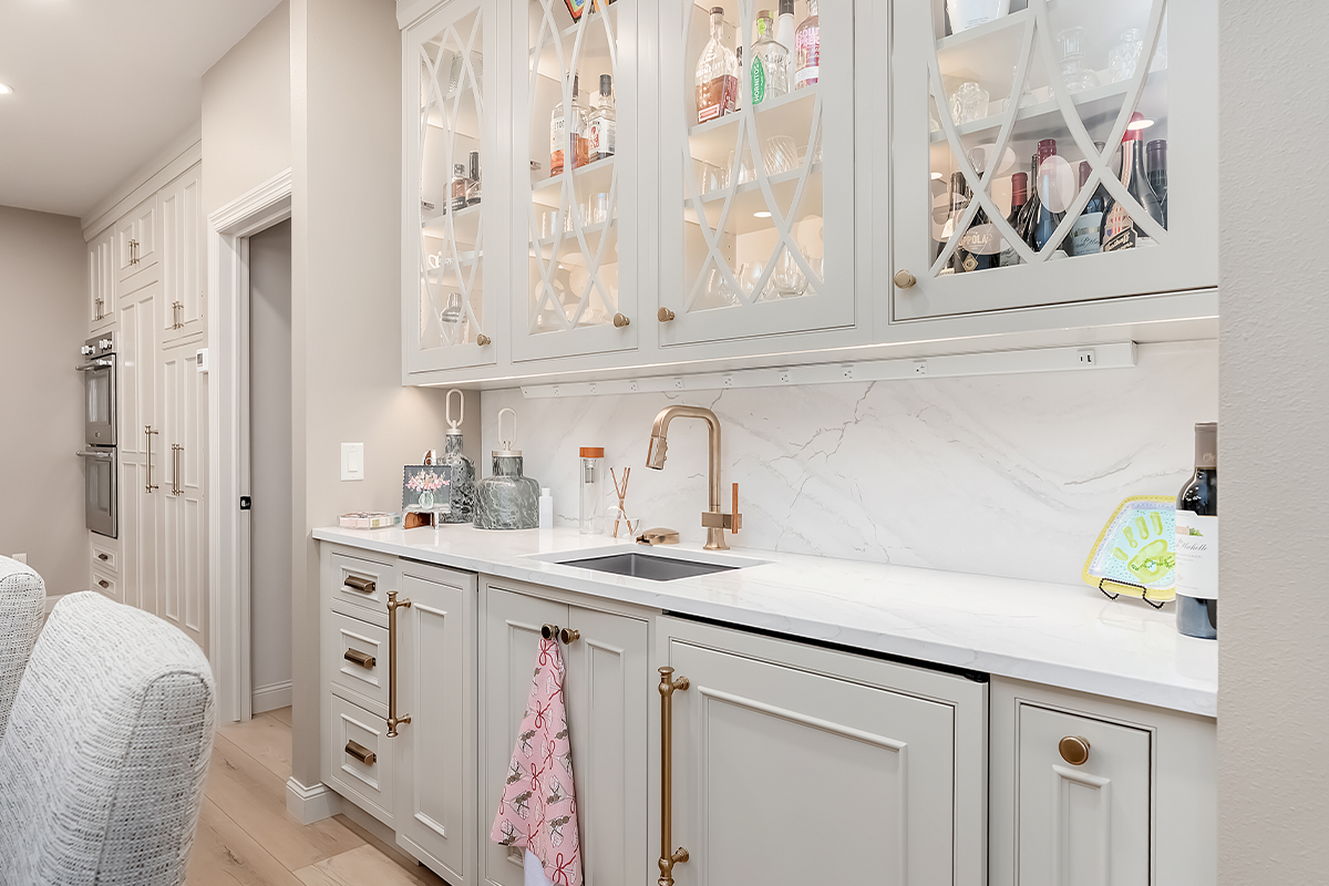 Beige painted bar cabinets with mullion doors