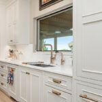 Beige painted bar cabinets with mullion doors