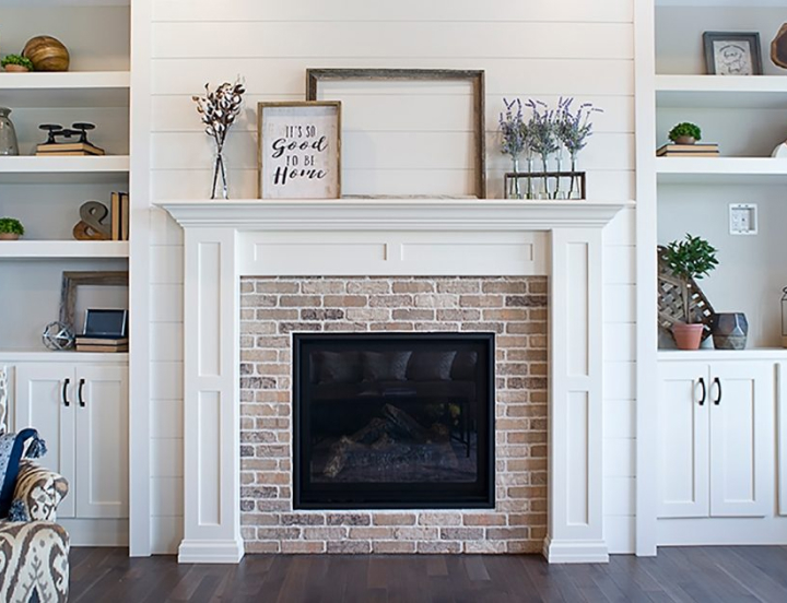 White Fireplace with Built-In shelving by Showplace Design Center