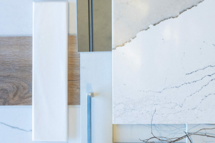 Flat lay of tile, cabinet and backsplash design for a white and gold kitchen with walnut floors and granite counters.