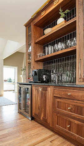 Walnut Stained Cabinet Bar in Kitchen by Showplace Design Center
