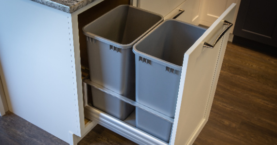 Base cabinet with waste basket kit